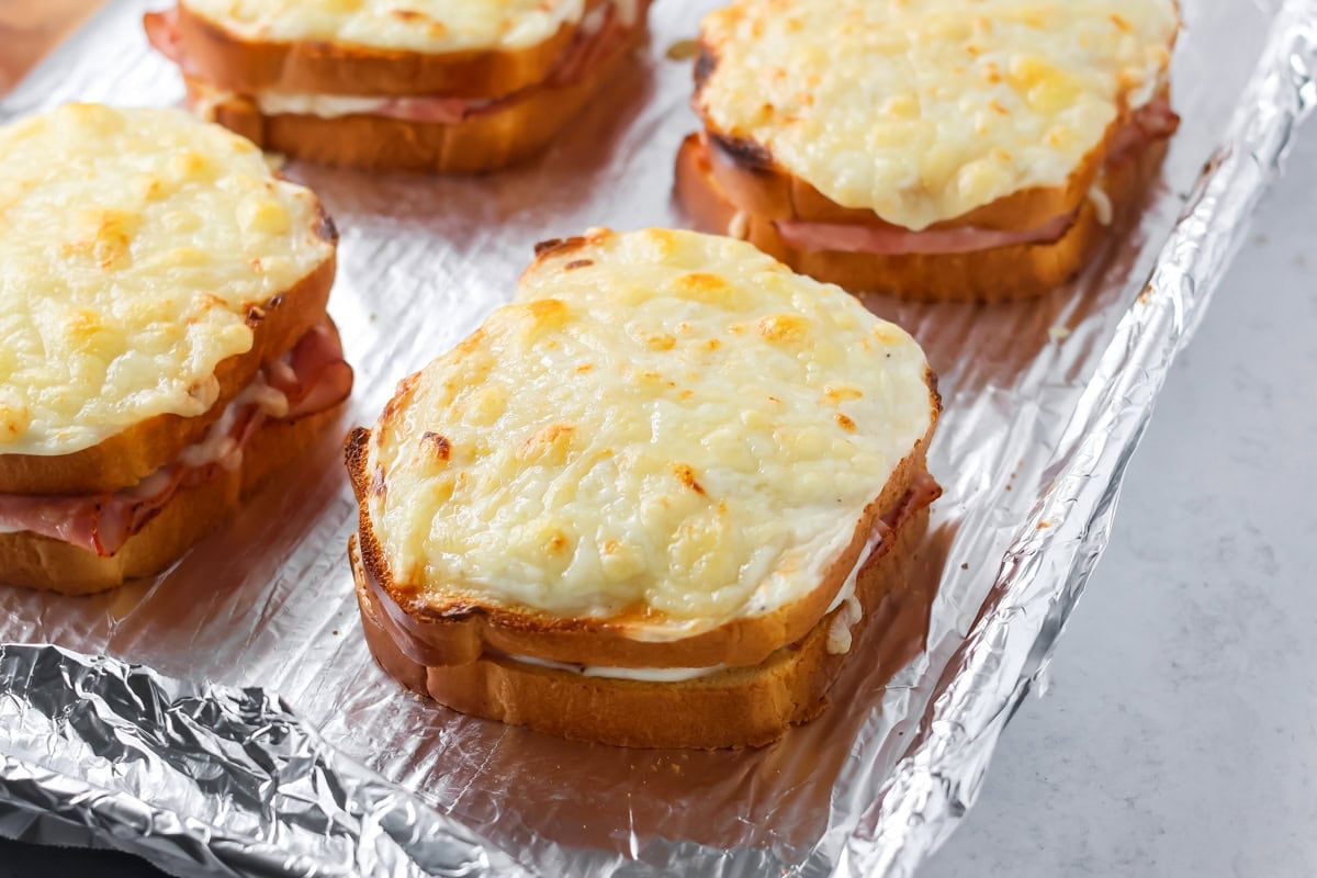Croque Monsieur recipe broiled on foil lined baking sheet.