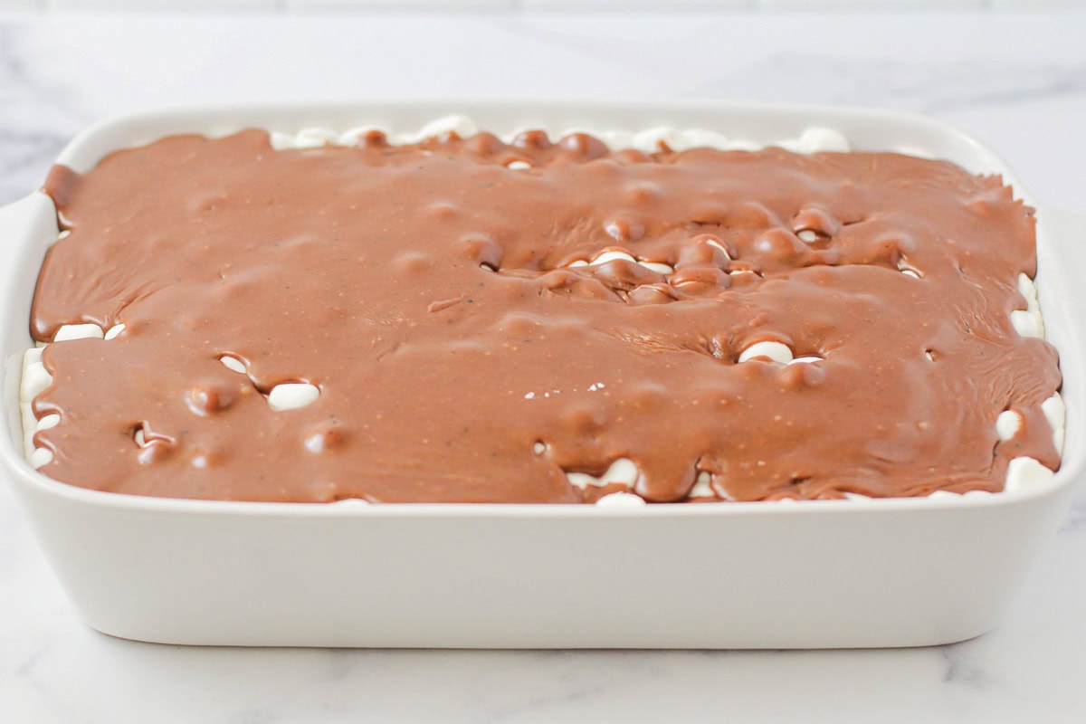 Chocolate frosting covering the marshmallow layer.