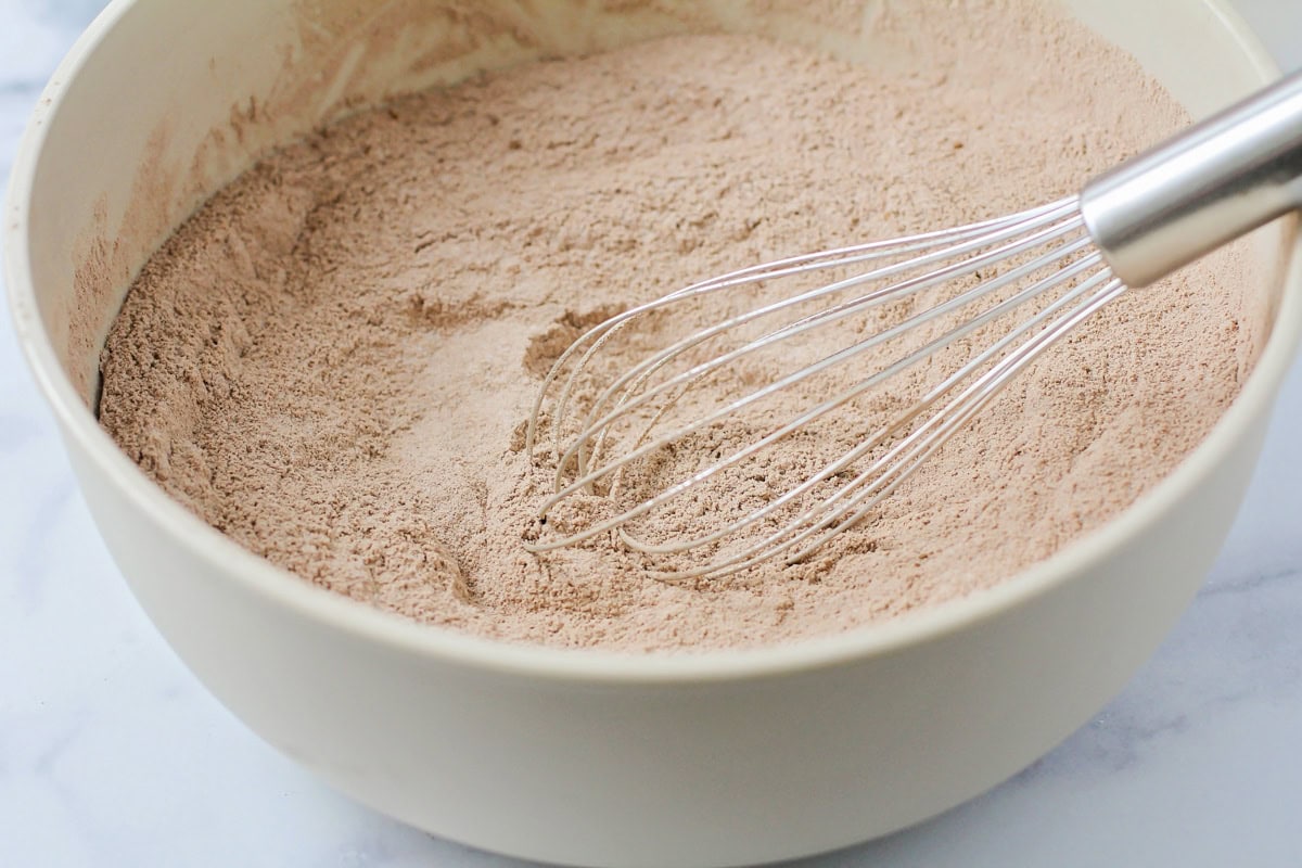 Dry cake ingredients in a bowl.