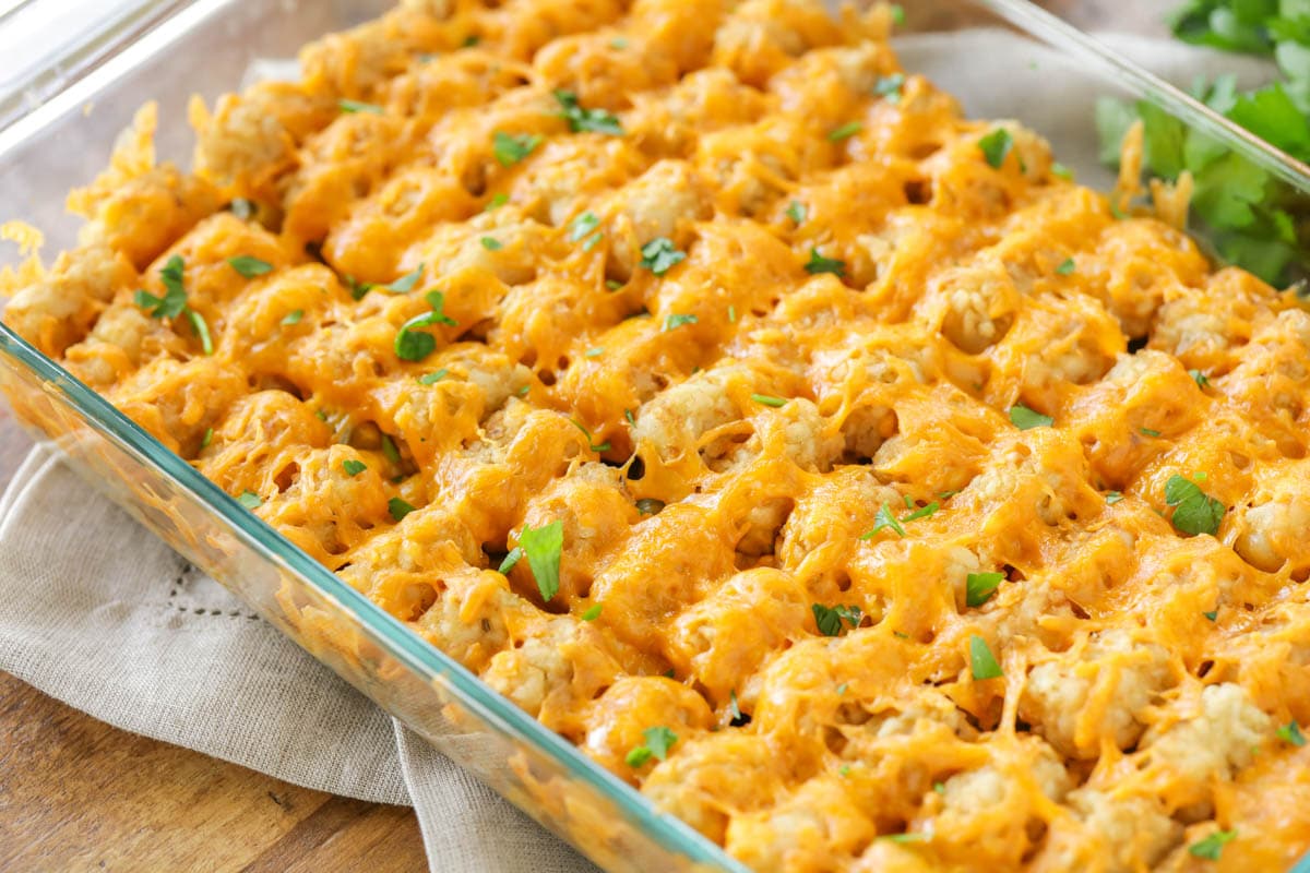 Hamburger tater tot casserole in a glass baking dish.