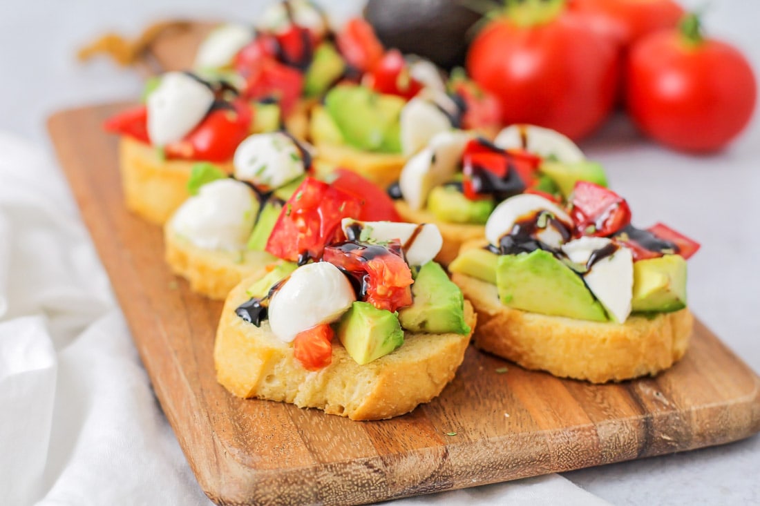 Bruschetta caprese on a cutting board