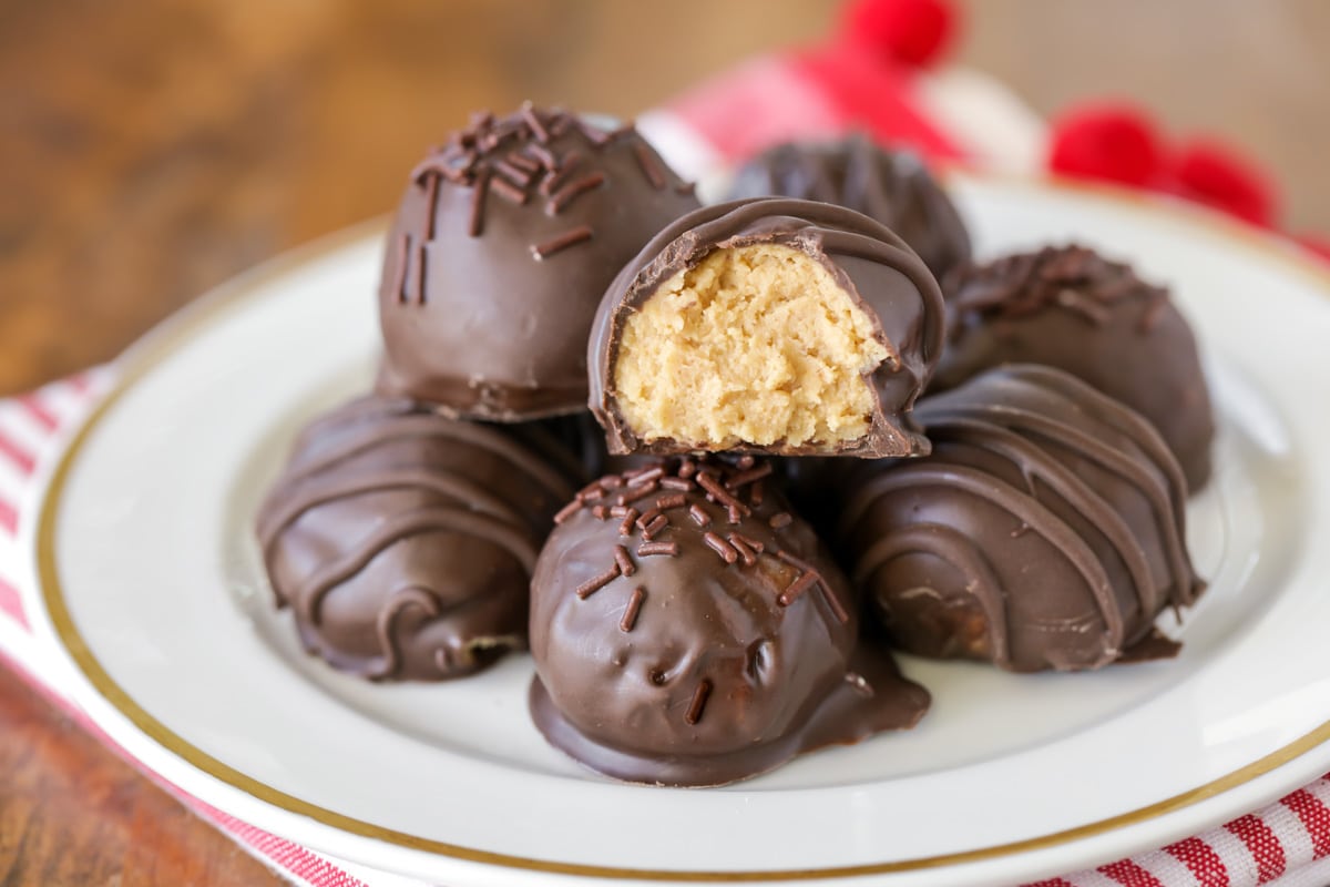 New years eve desserts - a pile of peanut butter balls with a bite missing from one.