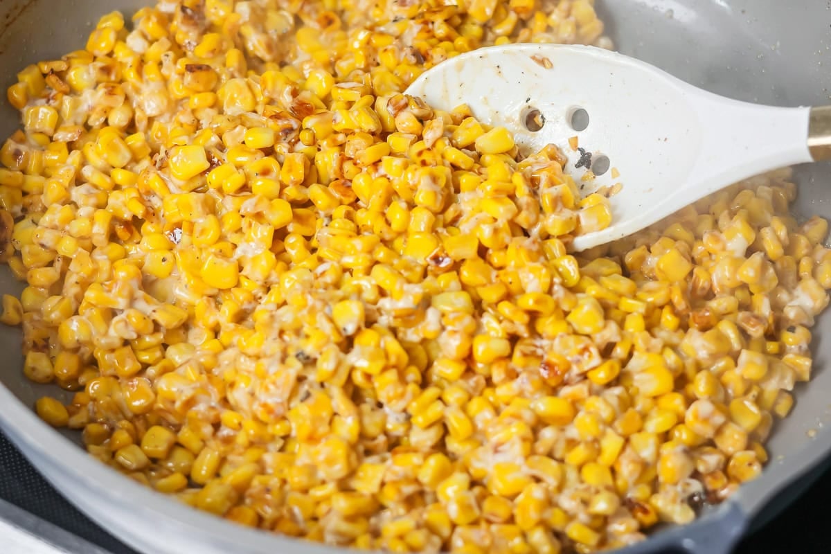 Esquites recipe cooked in a skillet.