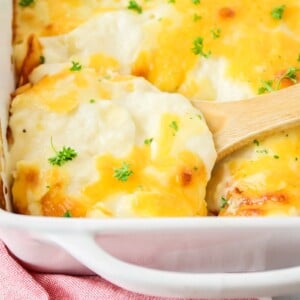 A casserole dish of classic easy scalloped potatoes.