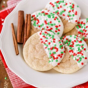 Christmas snickerdoodles dipped in white chocolate and topped with sprinkles.