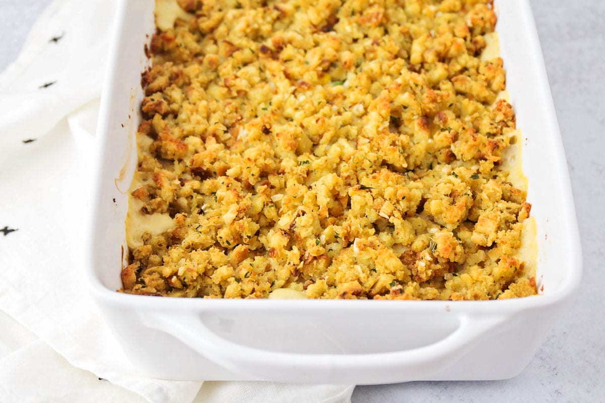 Leftover turkey recipes - close up of chicken stuffing casserole in a baking dish.