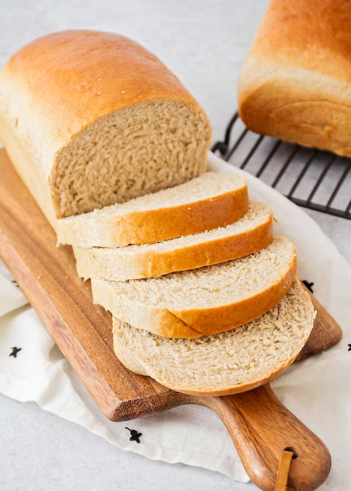 Sliced whole wheat bread on a cutting board