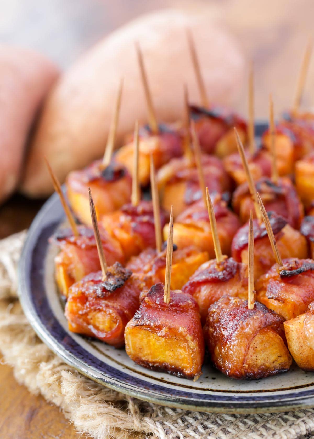 Bacon wrapped sweet potato bites served with toothpicks