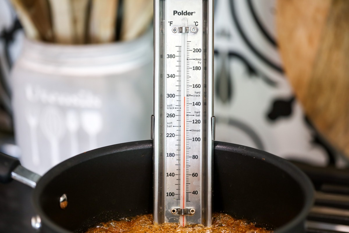 candy thermometer showing 300 degrees for the sponge candy mixture