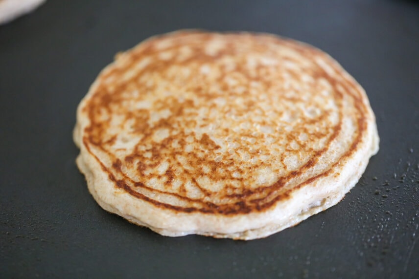 Whole wheat pancake cooking on a griddle