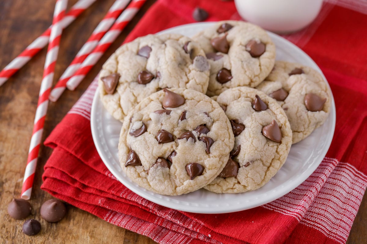 Easy cookie recipes - best chocolate chip cookies piled on a white plate.