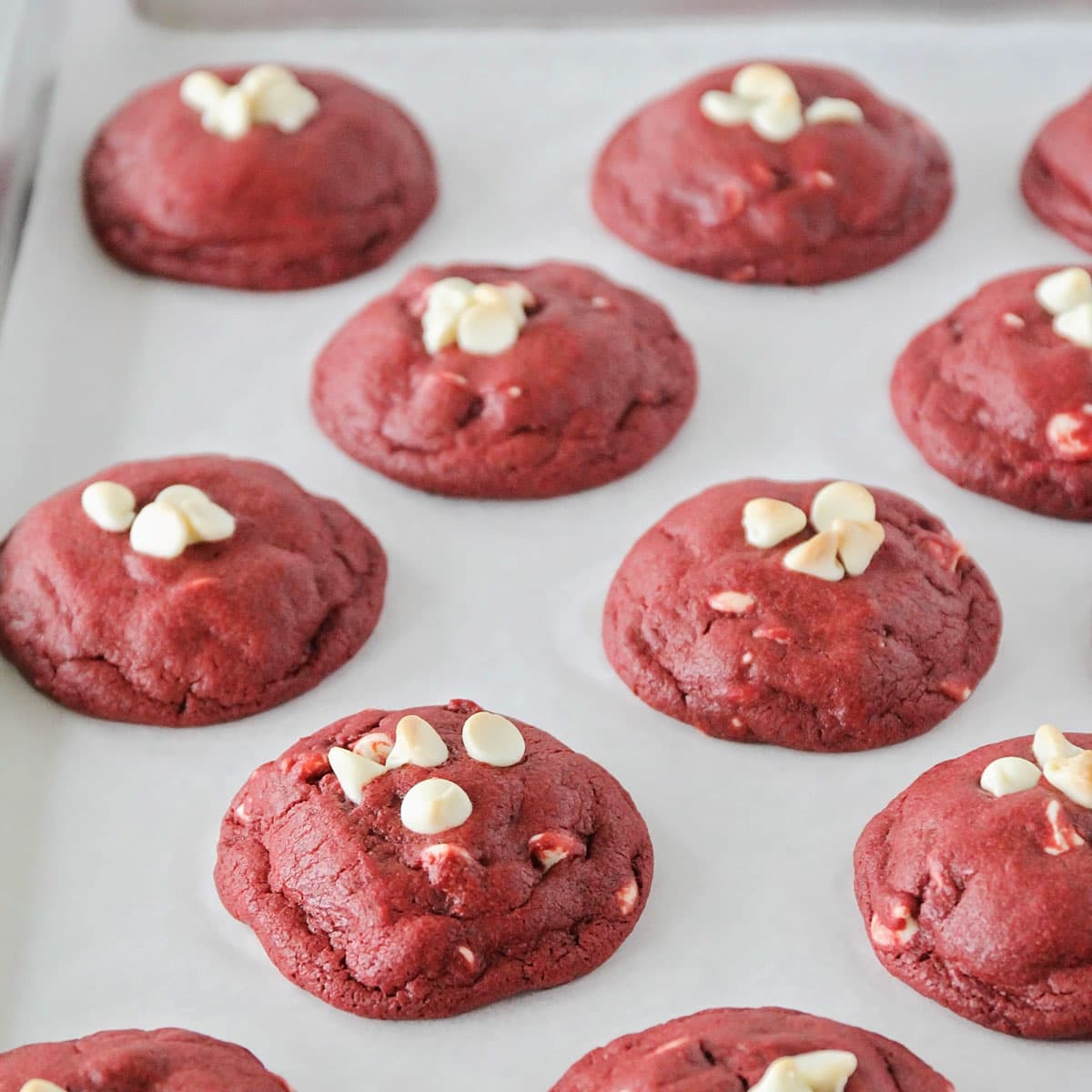 White chocolate red velvet cookies on a baking sheet