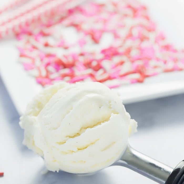 A scoop of vanilla ice cream to be used in a valentine shake