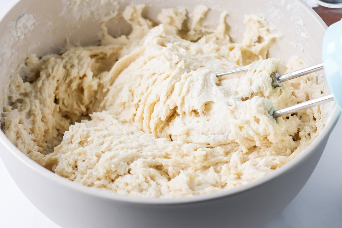 Friendship bread batter being mixed in mixing bowl.