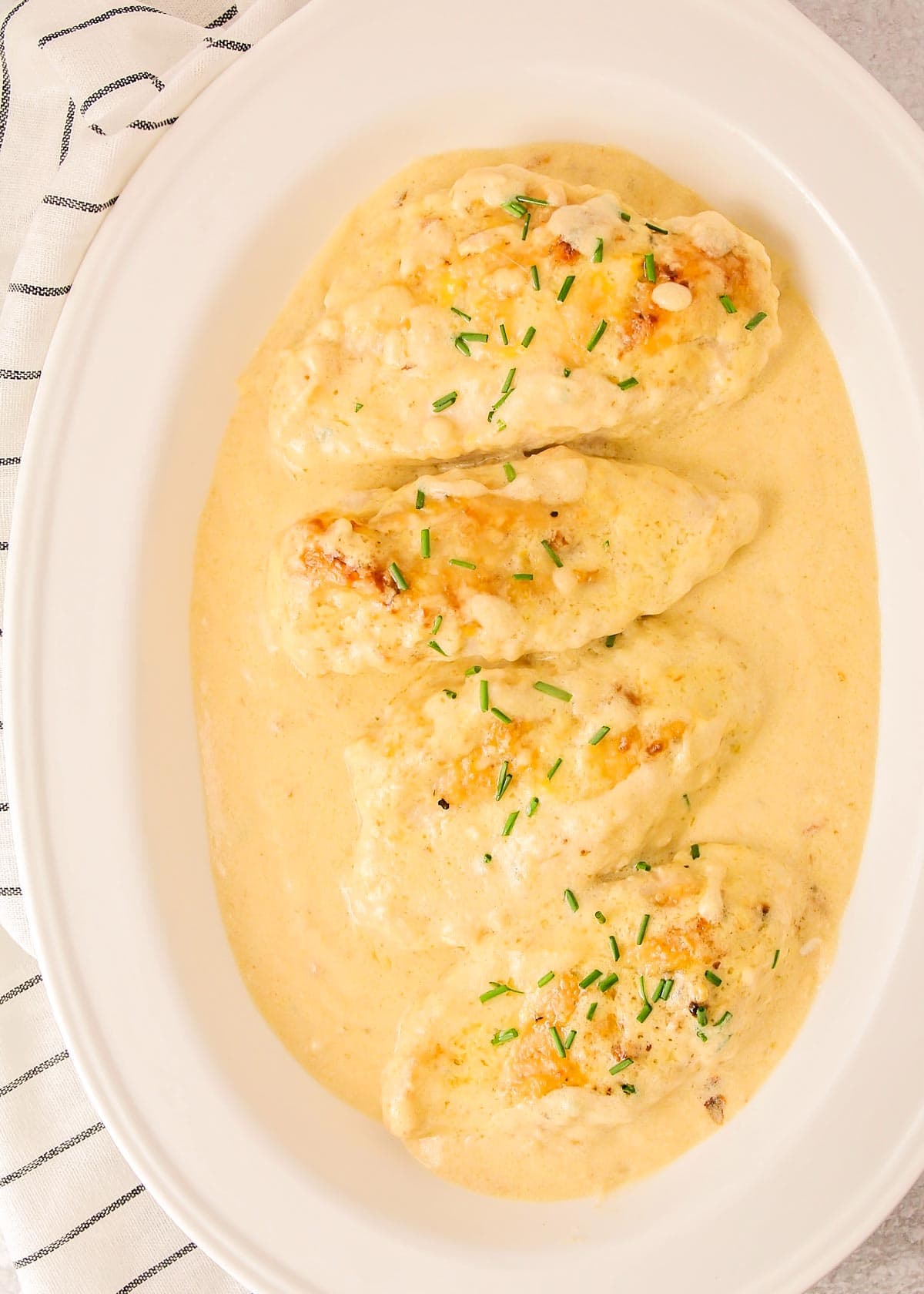 Butter chicken in a white casserole dish