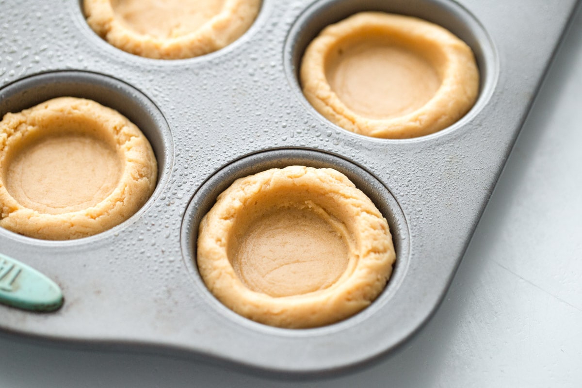 Easter Basket Cookie Cups pressed in muffin tin