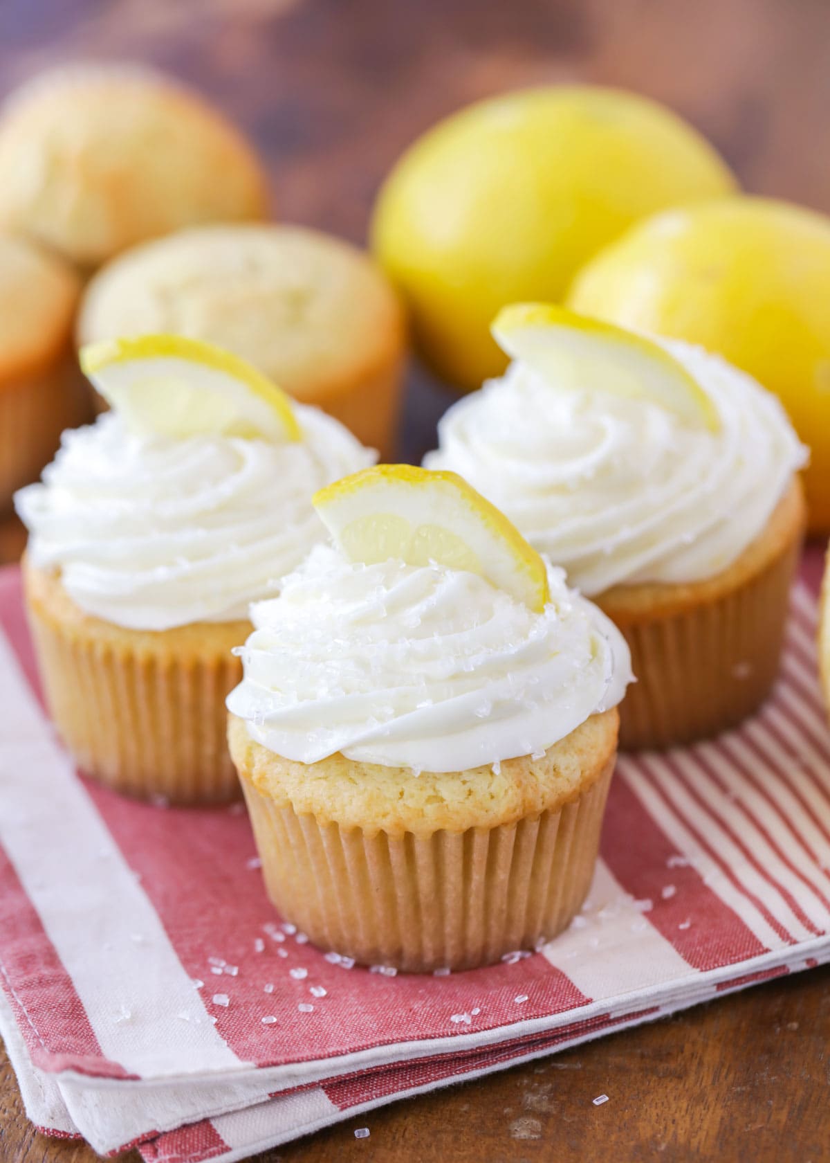 Lemon Cupcakes topped with fresh sliced lemons.