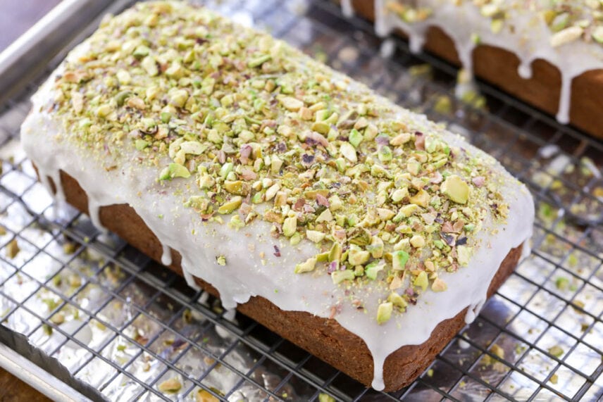 Pistachio bread with frosting and chopped pistachios on top