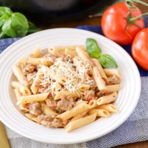 A bowl of fresh sausage penne pasta.