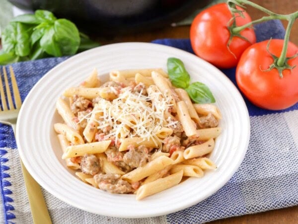 A bowl of fresh sausage penne pasta.