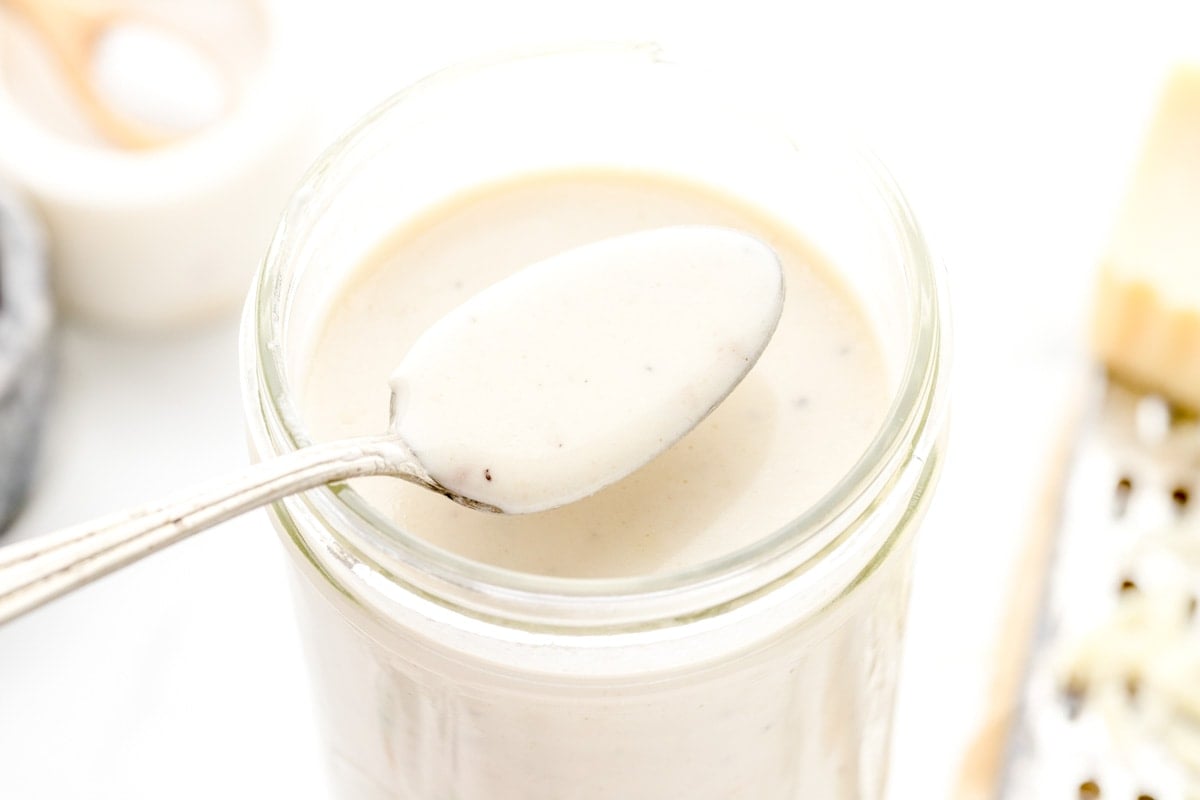 Jar filled with homemade alfredo sauce