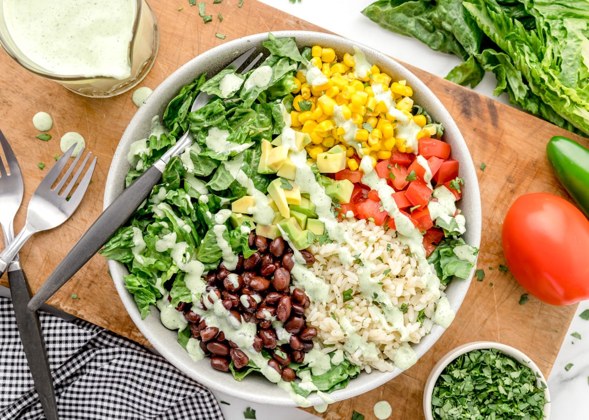 Salad topped with cafe rio cilantro ranch dressing.