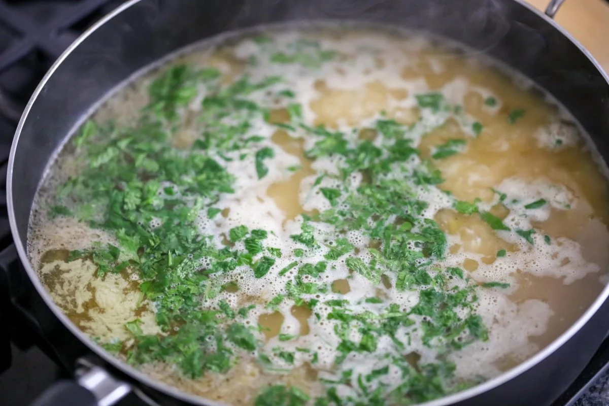 Cooking rice in a pot of water.