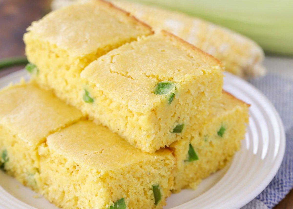 Stacks of jalapeno cornbread on a white plate