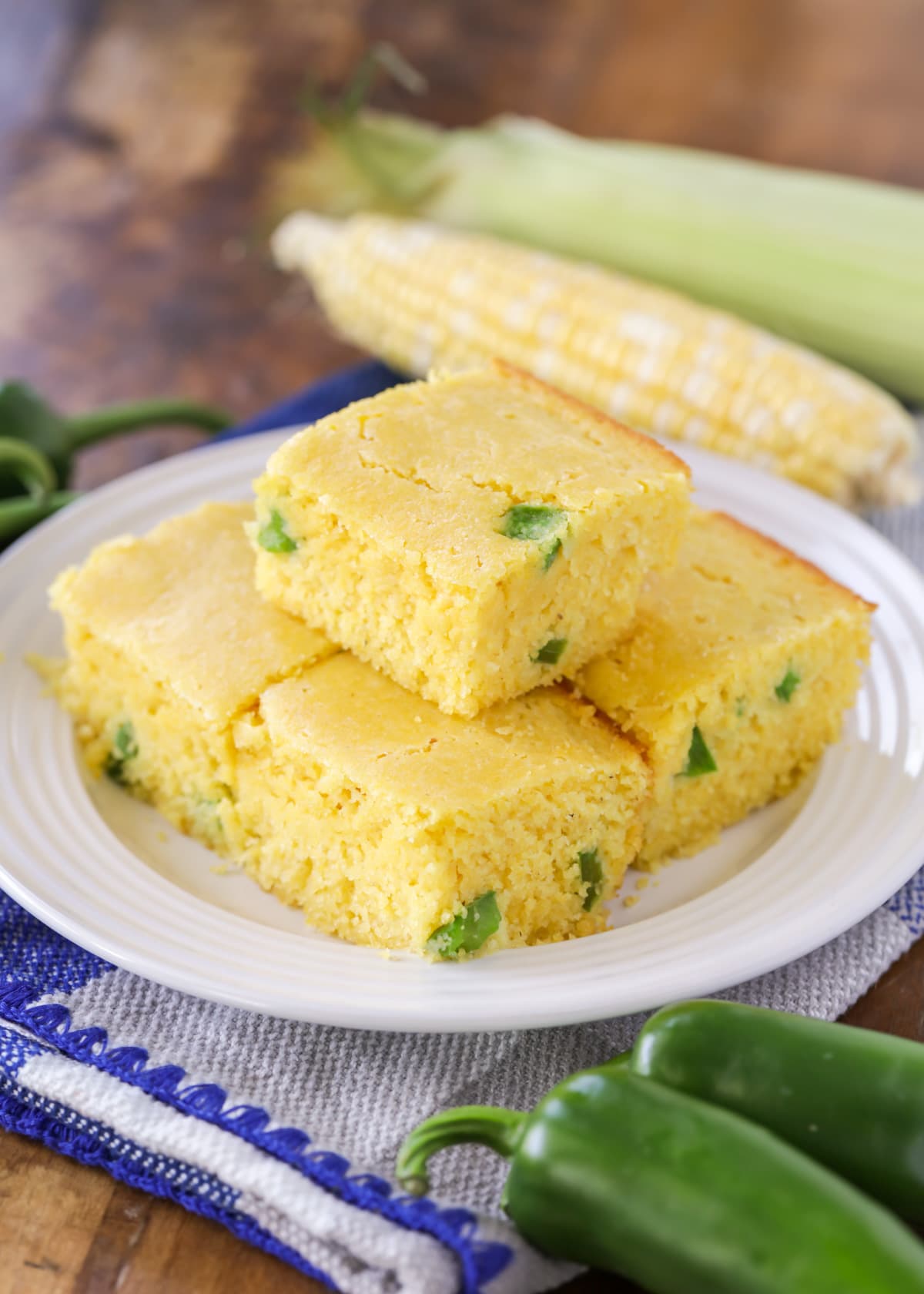 White plate topped with slices of fresh Jalapeno cornbread