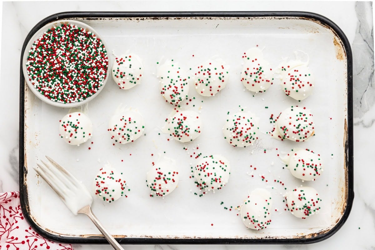 Topped peanut butter snowballs with sprinkles.