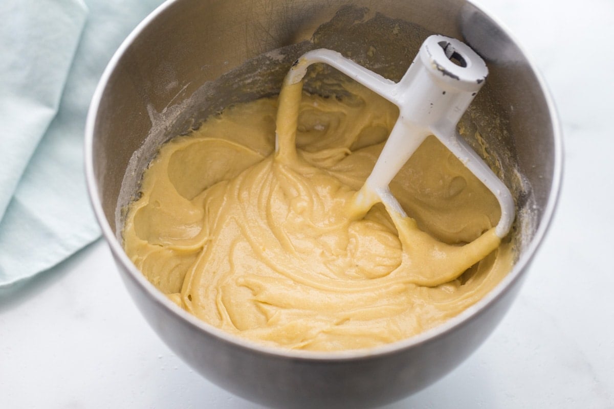 Mixing batter for tres leches cake recipe