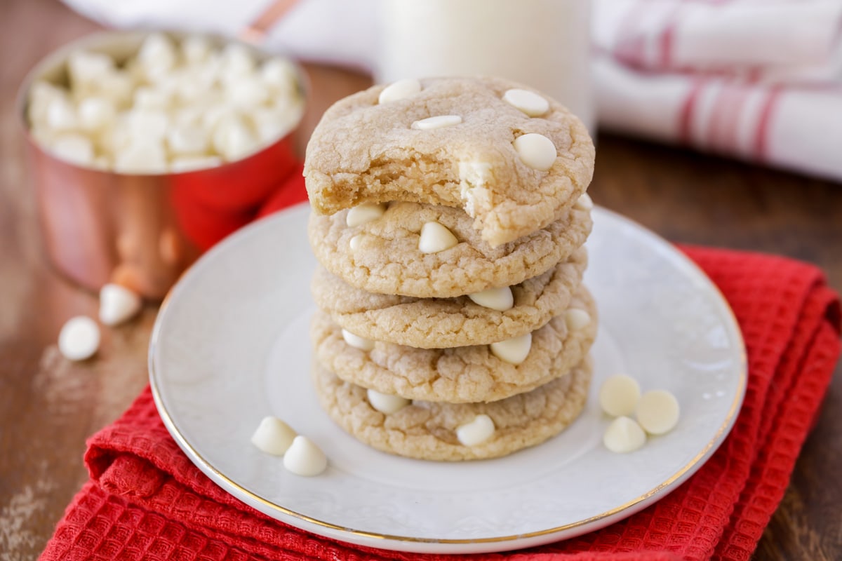Stack of white chocolate chip cookies on a plate