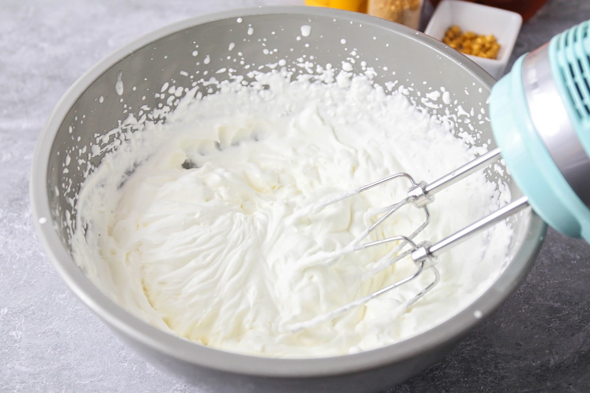 Process picture of whipping cream for topping butterbeer.