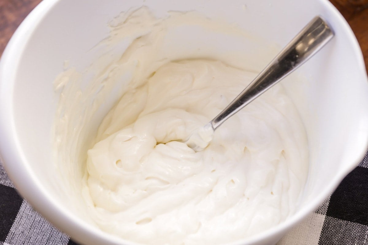 Mayo dressing in a white bowl.