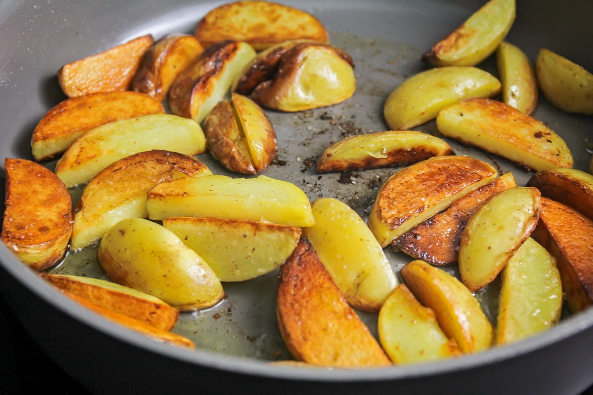 Browned potato wedges for one pan steak and potatoes.