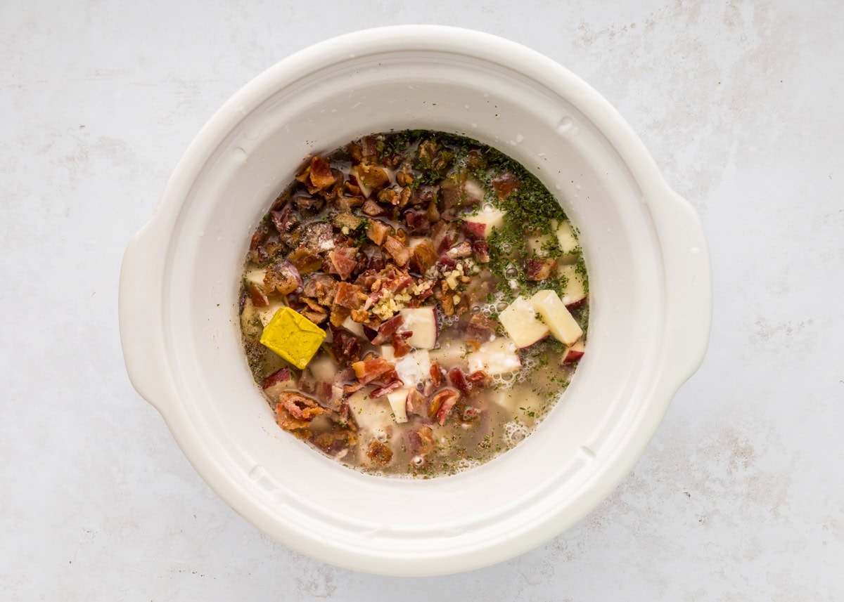 Process picture of crock pot baked potato soup recipe.