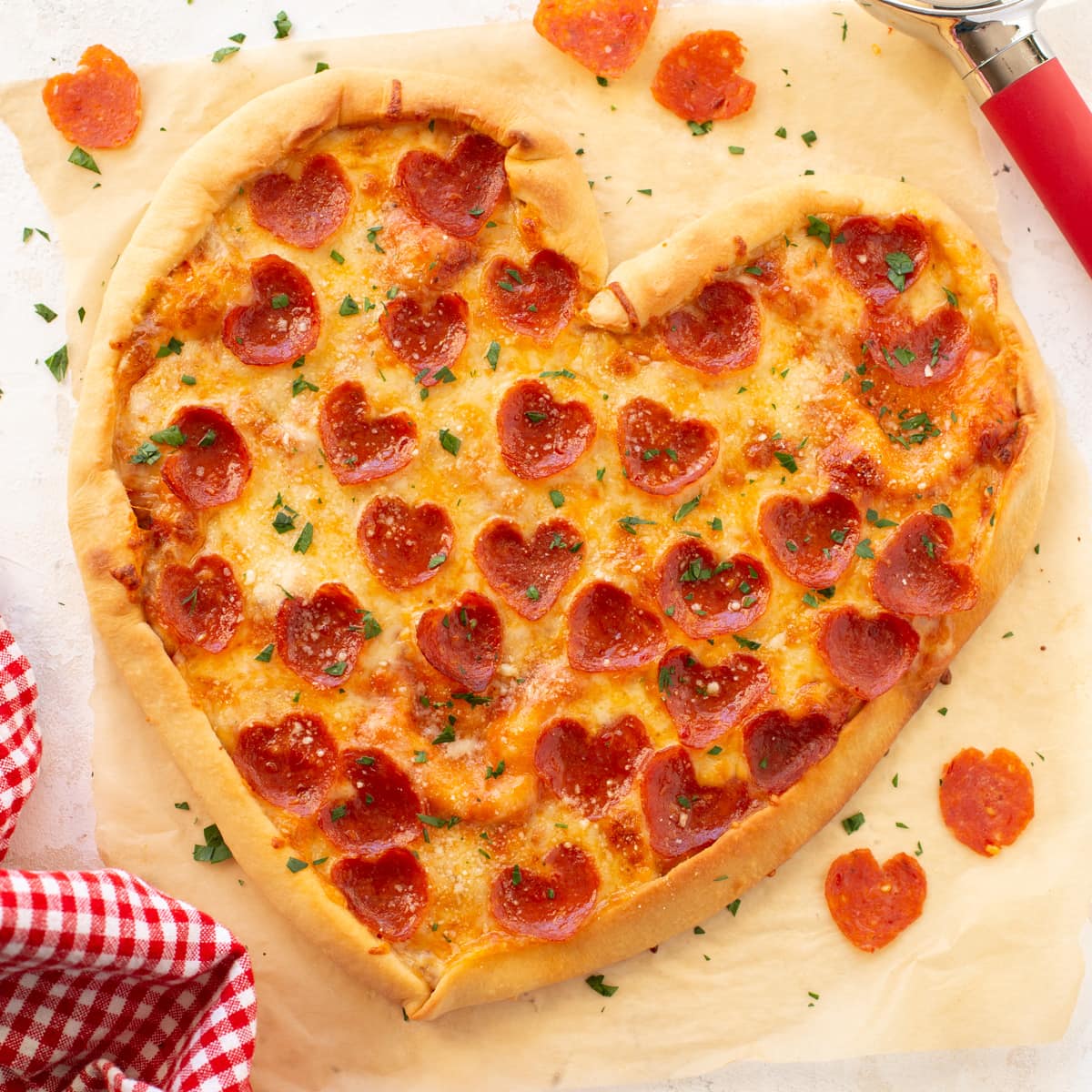 Quick dinner ideas - heart shaped pizza on a cutting board.