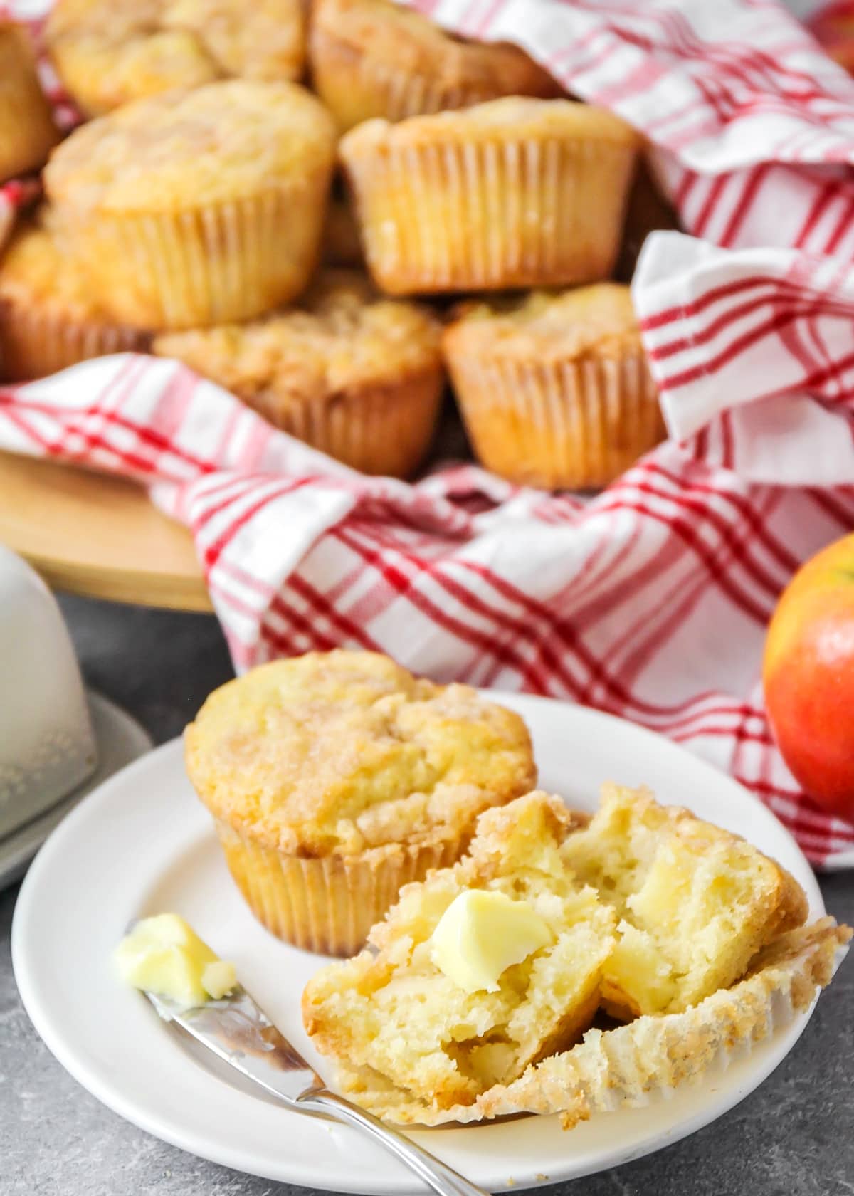 Close up of apple muffins in a red and white dish cloth