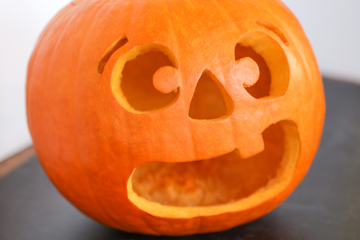 Pumpkin guacamole carved jack o lantern.