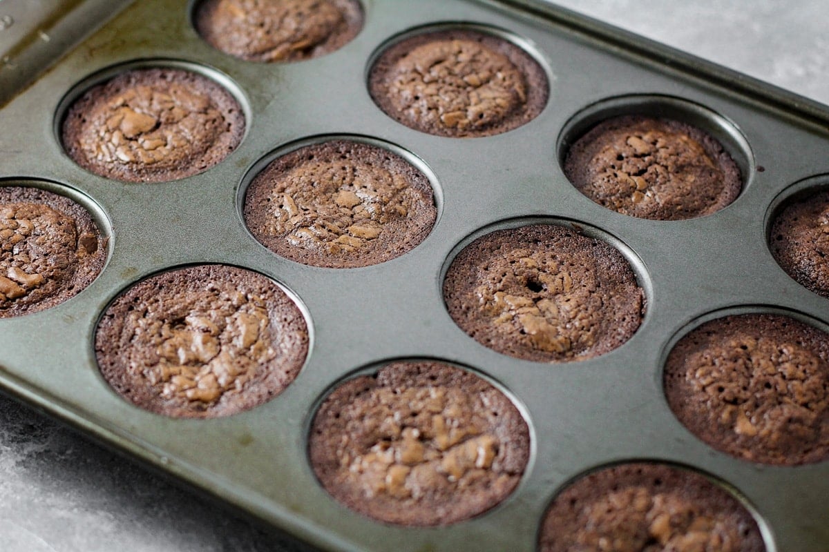 Chocolate brownie bites cooked in a muffin tin.