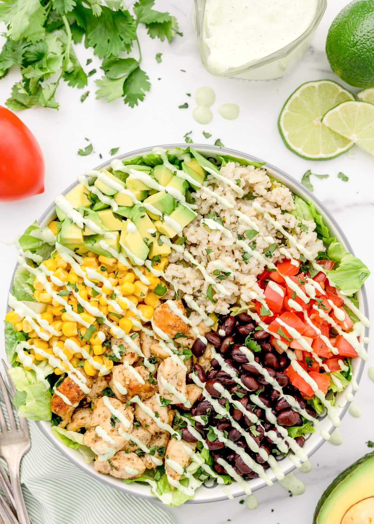 Dressing drizzled on a chicken burrito bowl recipe.