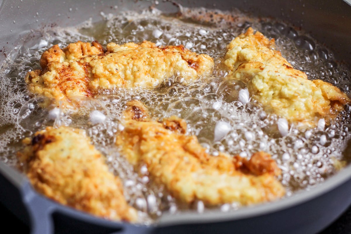 How to fry chicken fingers in a skillet.