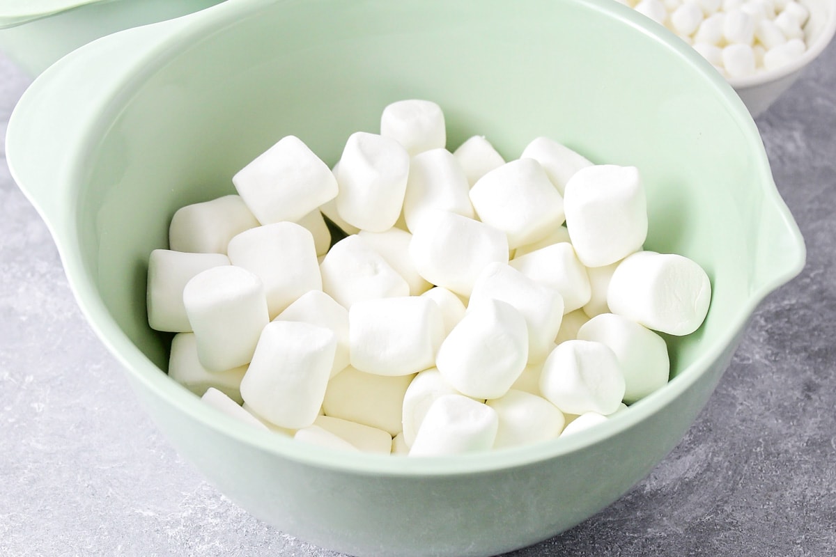 Marshmallows in a mint bowl for chocolate rice krispie treats.