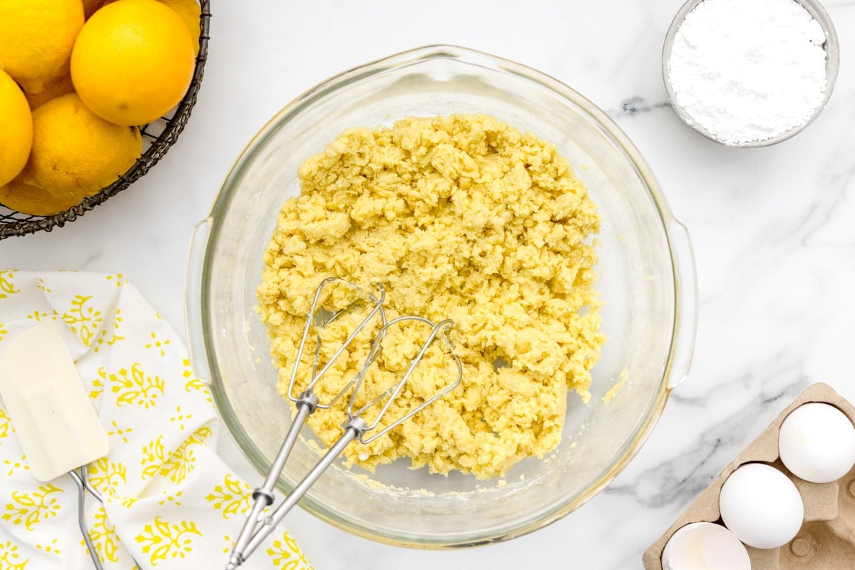 mixing the batter for lemon bars with cake mix
