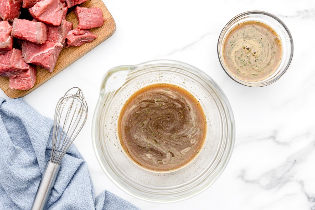 Marinade for steak kabobs in a glass bowl.