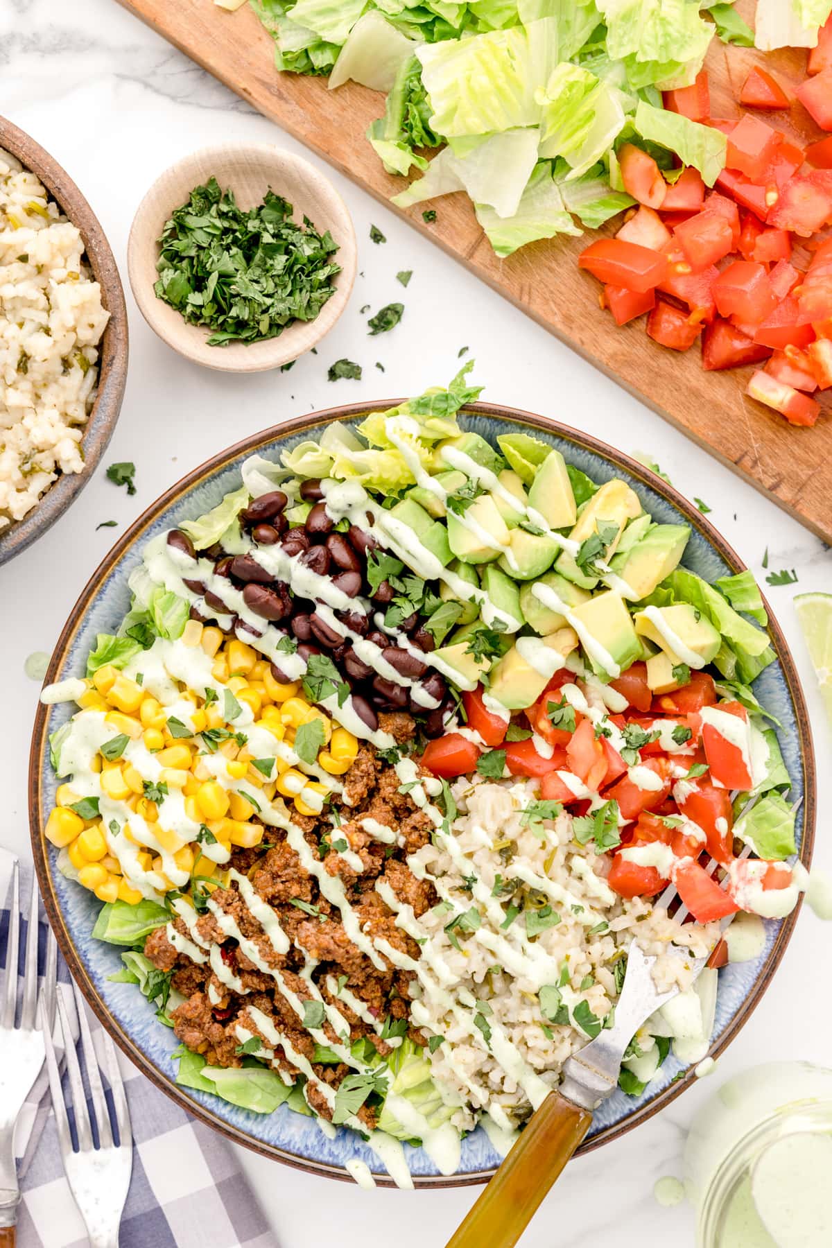 Taco bowl drizzled with creamy cilantro dressing