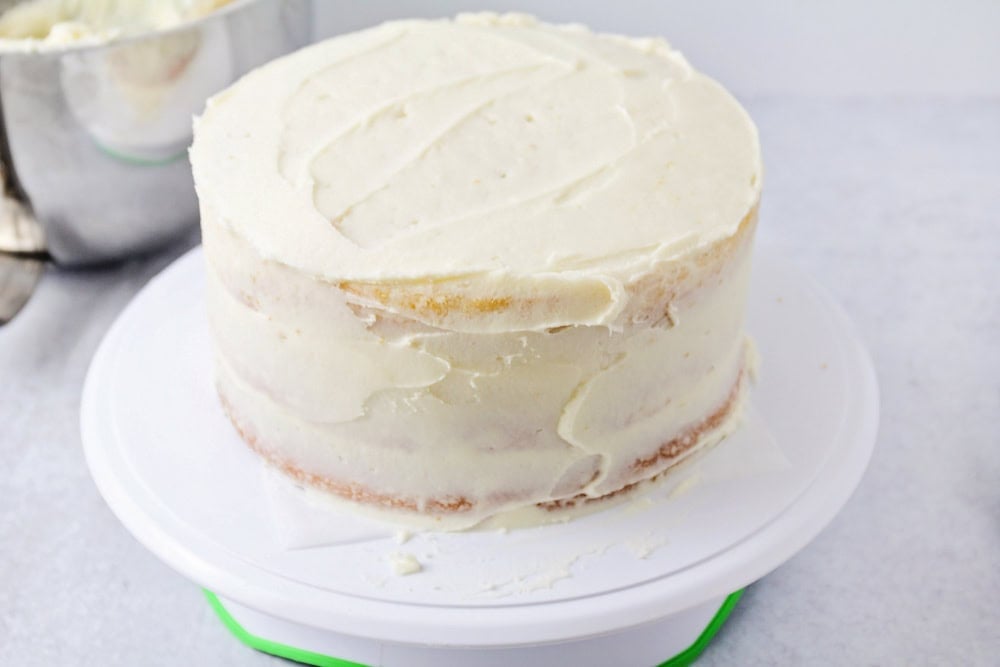 Delicious vanilla cake recipe being made on cake stand.