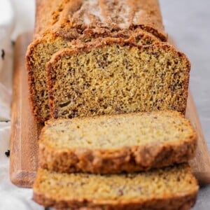 Best banana bread recipe sliced and served on a cutting board.