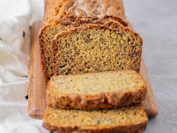 Best banana bread recipe sliced and served on a cutting board.