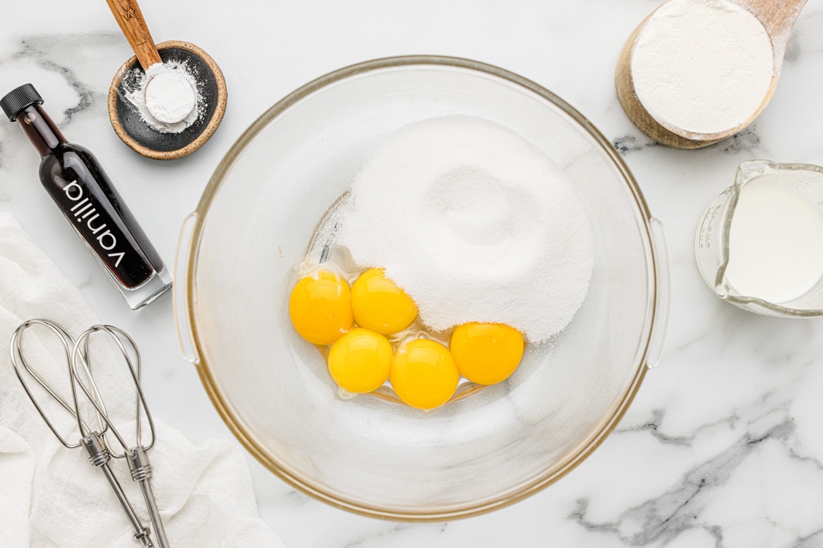 Eggs and sugar in a bowl.